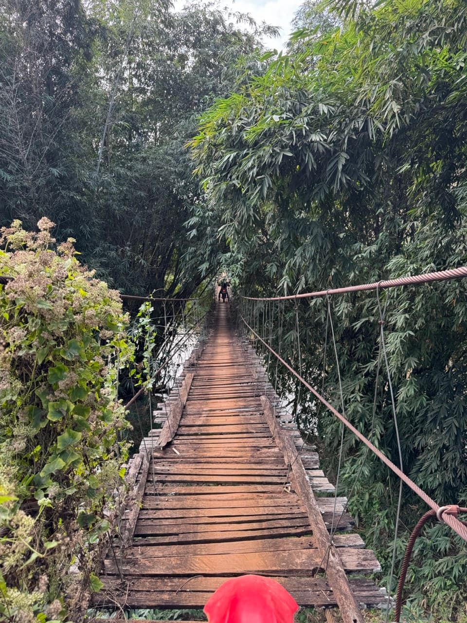 A second wooden bridge a little further on — same idea, different river.
