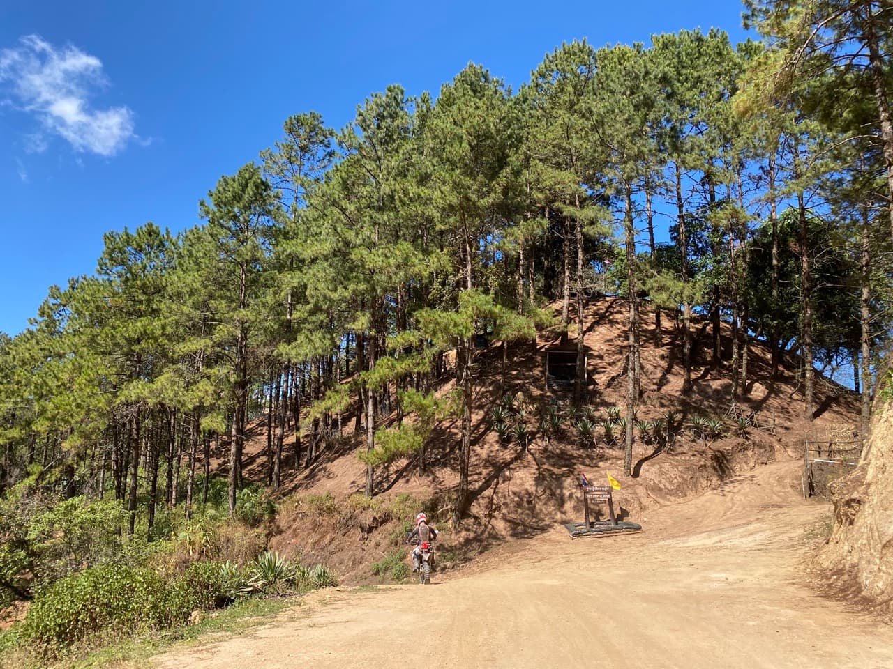 Sandy switchback. Stay light on the bars, momentum forward.